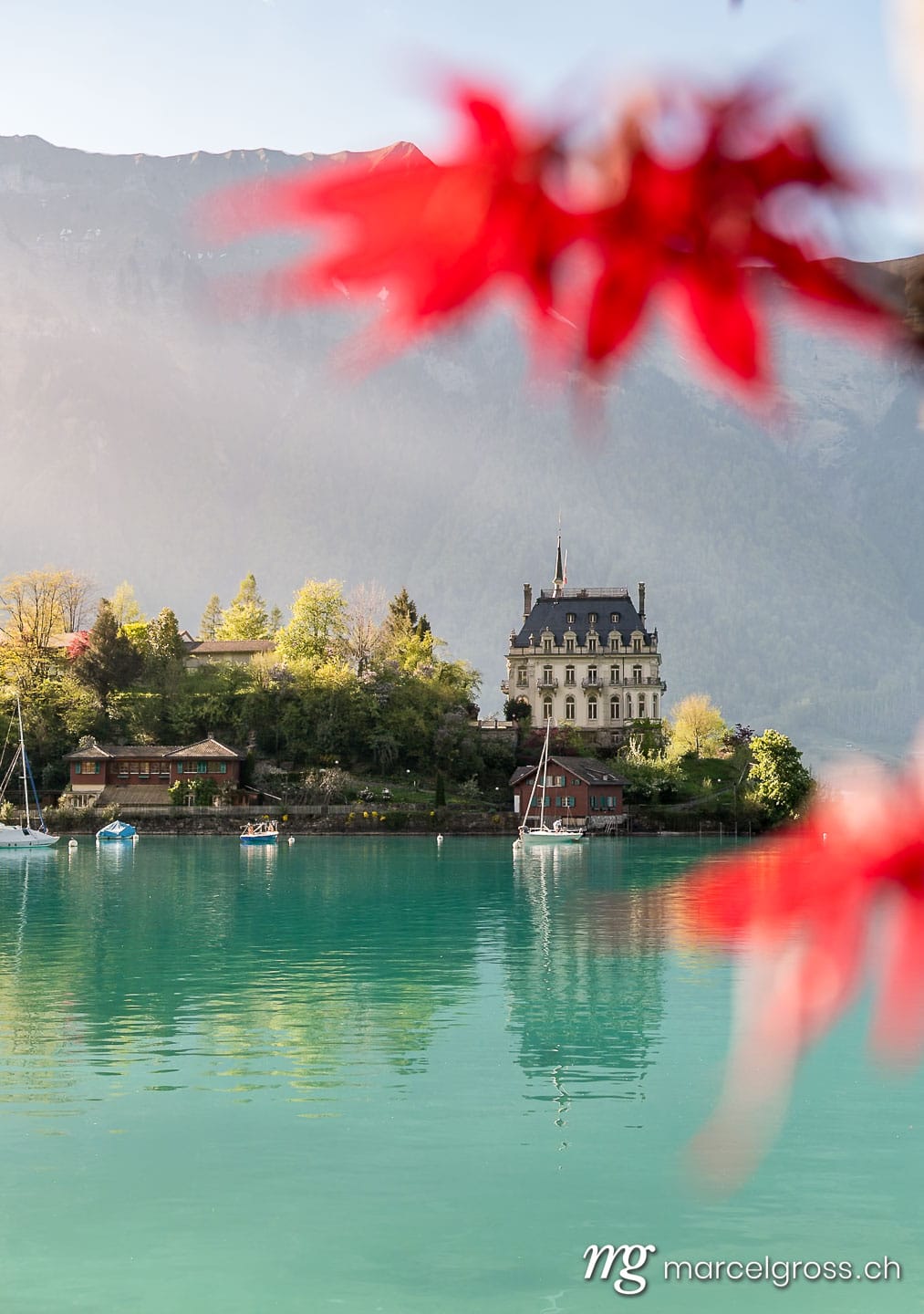 Frühlingsbilder Schweiz. view of Schloss Seeburg, Iseltwald in turquoise Lake Brienz. Marcel Gross Photography