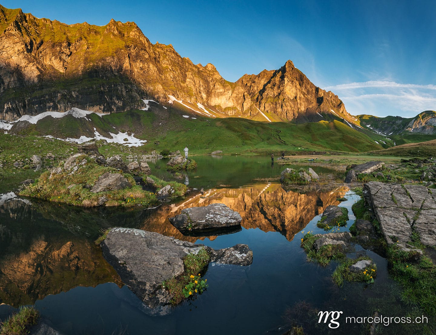 Sommerbilder Schweiz. peak of Hochstollen with reflection in alpine lake near Melchseefrutt at sunrise in the swiss alps. Marcel Gross Photography