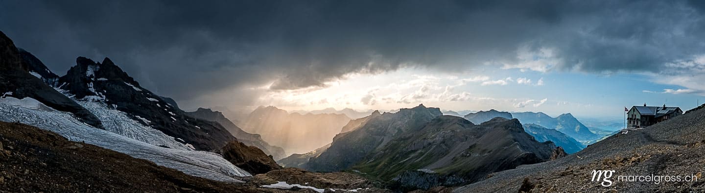 Panoramabilder Schweiz. panorama of Blümlisalpgletscher at Blüemlisalphütte SAC in dramatic afternoon light. Marcel Gross Photography