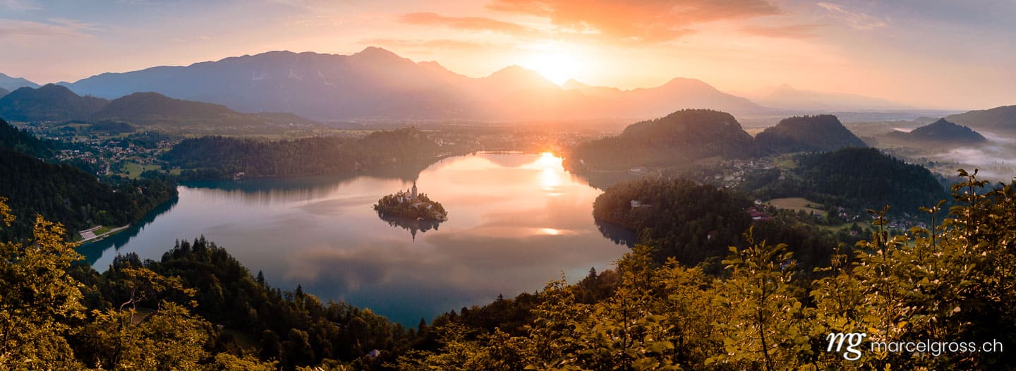 slovenia pictures. Sunrise over Lake Bled with famous island with church. Marcel Gross Photography