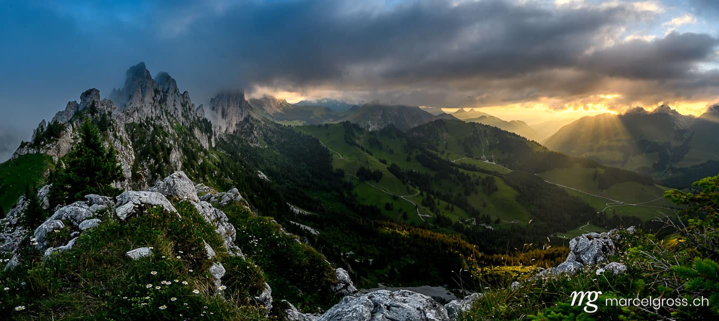 . dramatic sunset with clouds in the Alpine foothills of Fribourg and the impressive Gastlosen peaks. Marcel Gross Photography