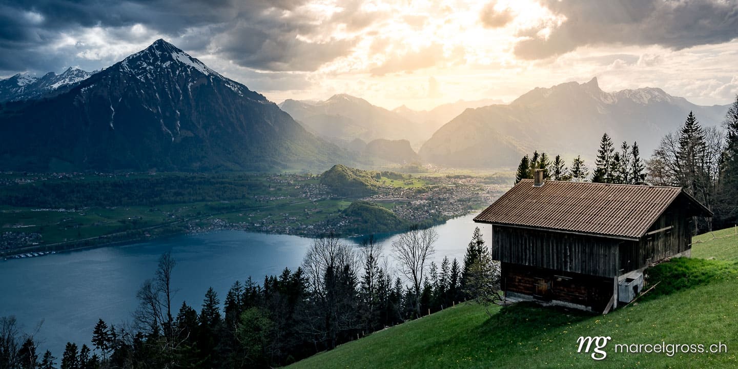 . dramatic light on Lake Thun and over Thun seen from over Sigriswil. Marcel Gross Photography