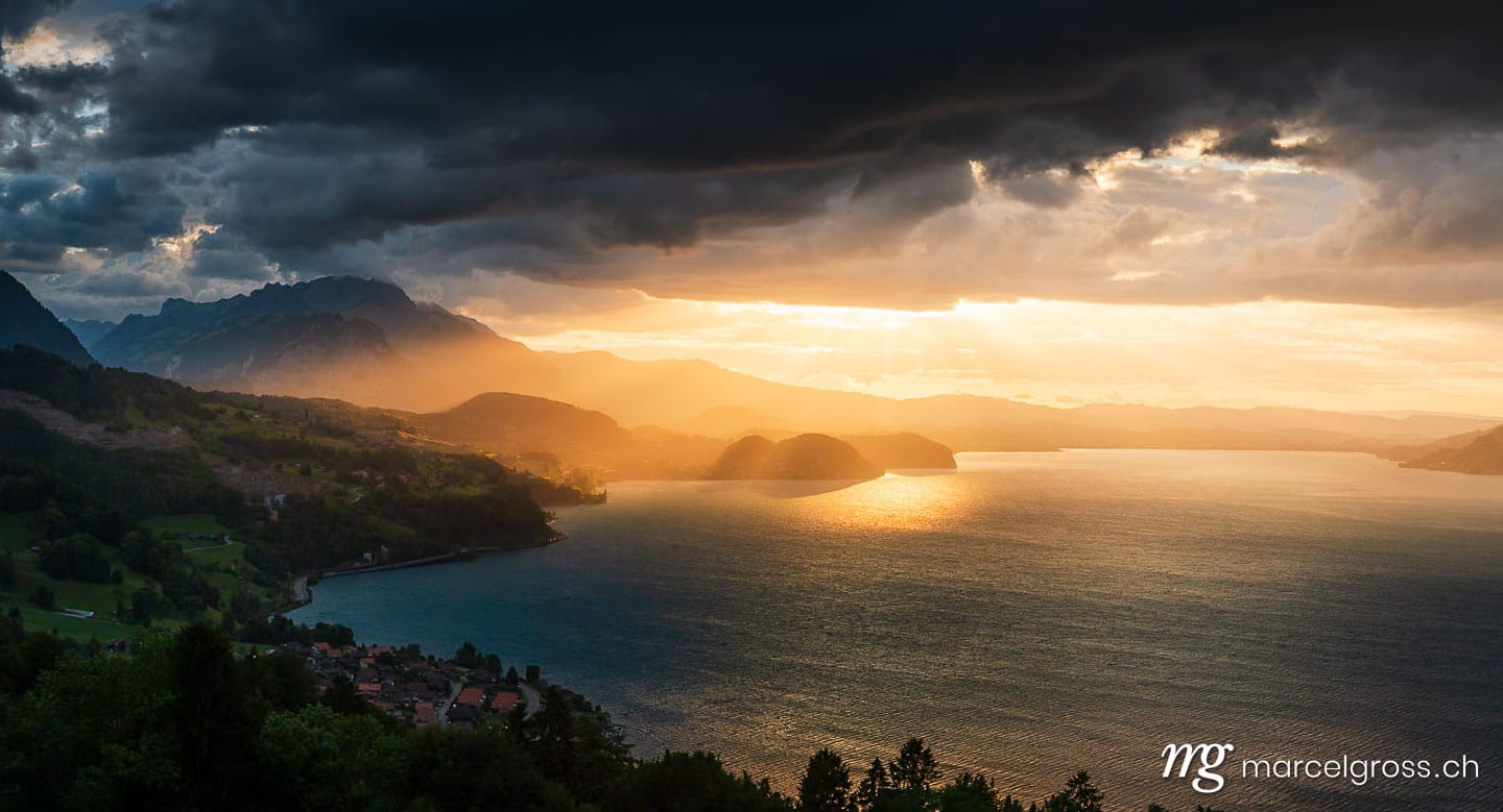 . dramatic sunset over Lake Thun with Stockhorn ridge, Spiez and Faulensee. Marcel Gross Photography