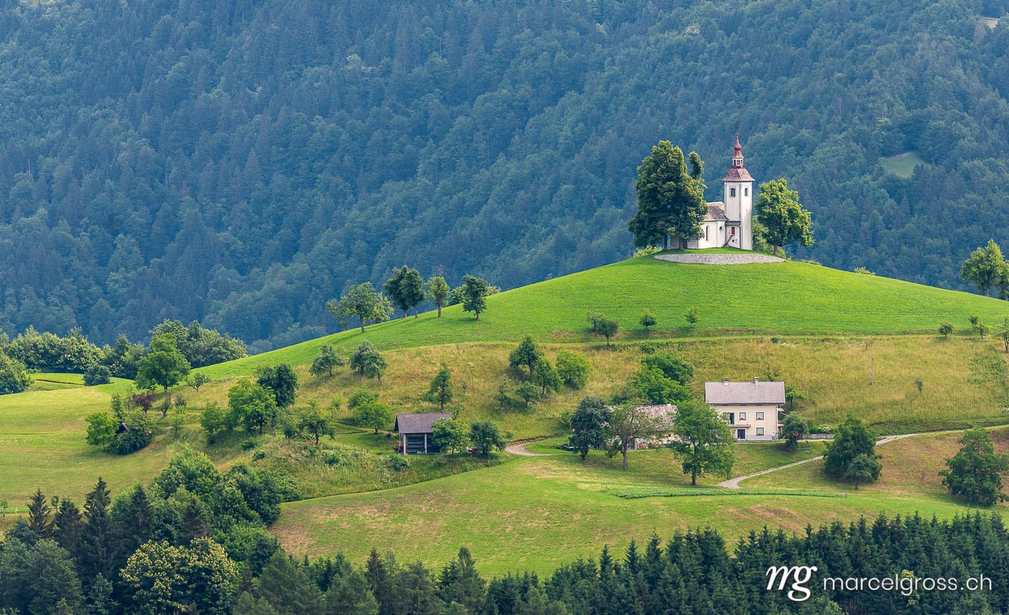 slovenia pictures. church on top of a hill in Slovenia. Marcel Gross Photography