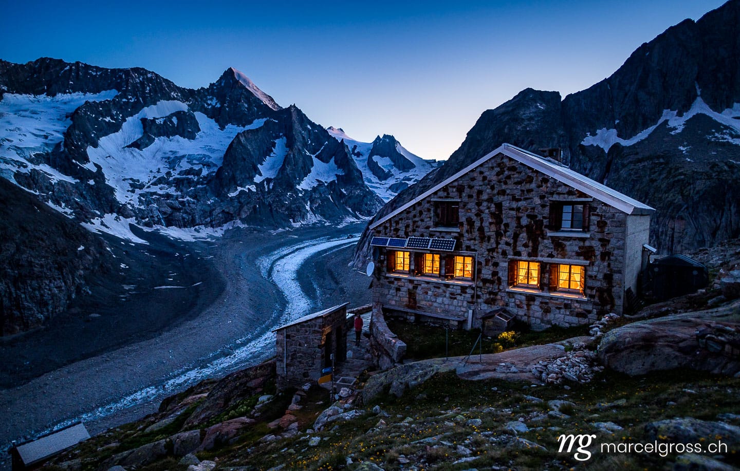 . blue hour at dawn at a swiss alpine club mountain hut in the valais alps. Marcel Gross Photography