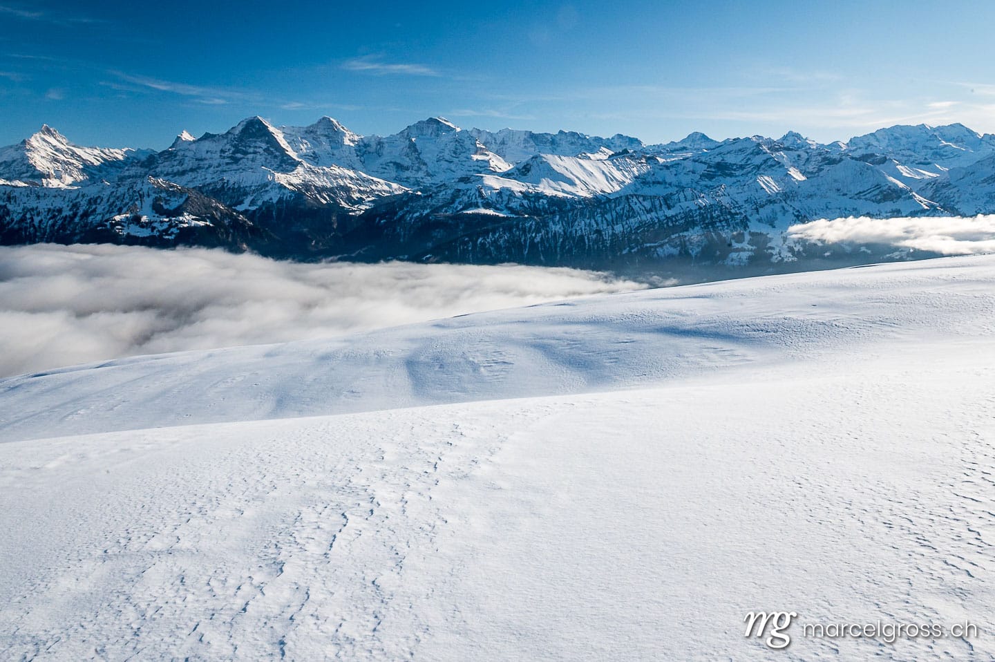 Winterbild Schweiz. Eiger Mönch and Jungfrau in winter with snow drifts. Marcel Gross Photography