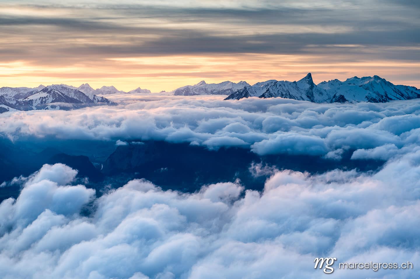 . sea of fog in front of Mount Stockhorn at a winter sunset. Marcel Gross Photography