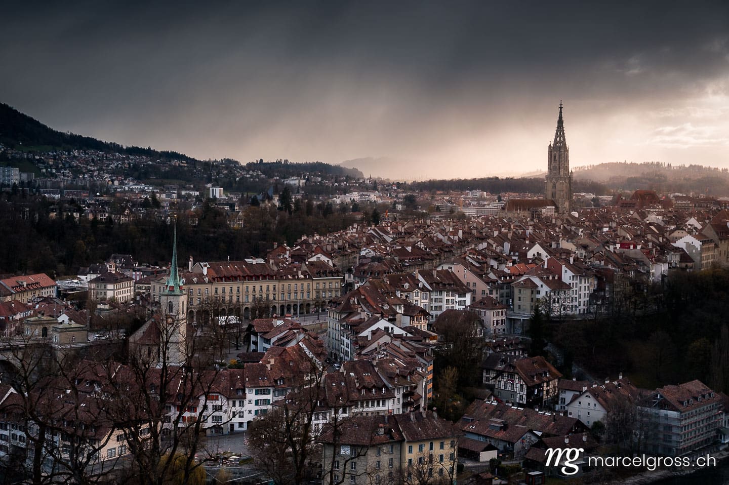 Bern Bilder. dramatic clouds over the oldtown of Bern in spring. Marcel Gross Photography