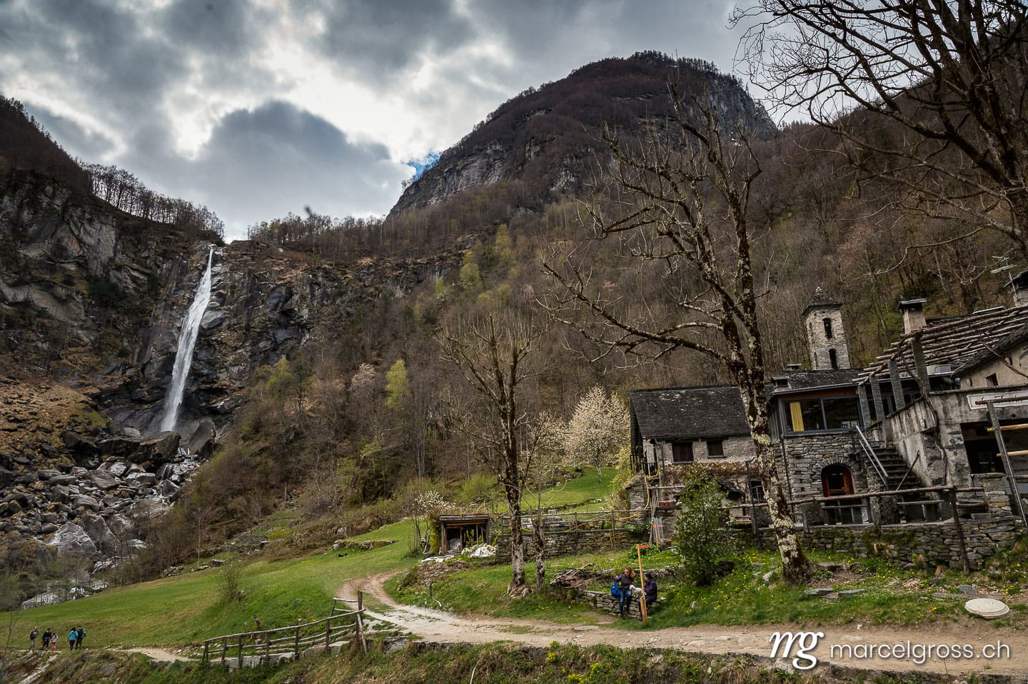 Tessin Bilder. picturesque town of Foroglio with the impressive waterfall in spring, Valle di Bavona, Ticino. Marcel Gross Photography