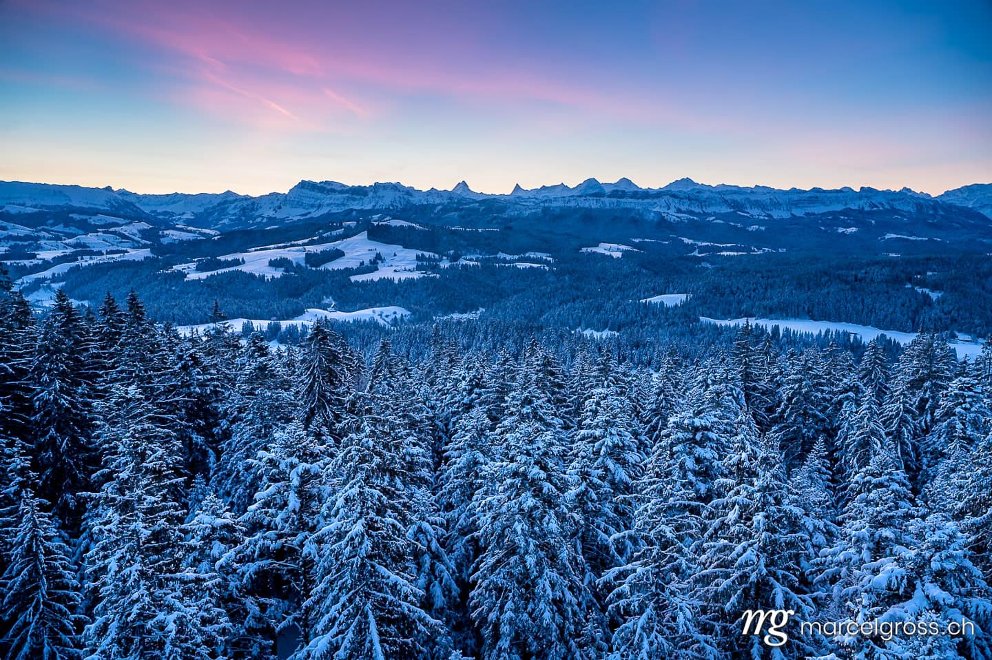Winter picture Switzerland. Panorama of Emmental on a winter morning with Bernese Alps. Marcel Gross Photography