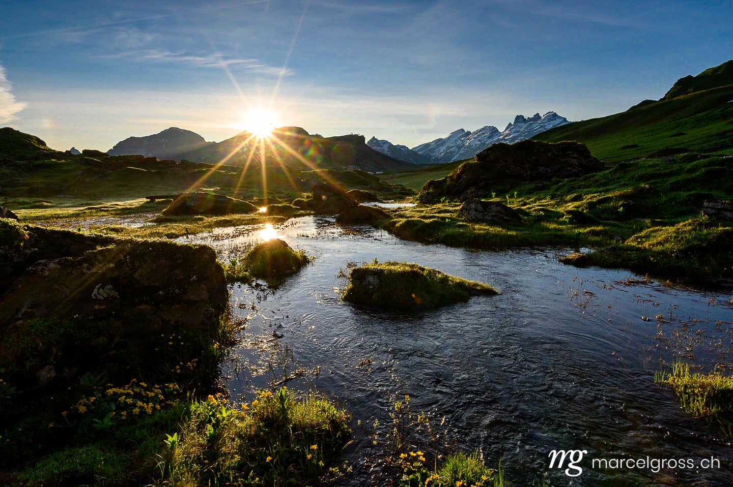 Sommerbilder Schweiz. peak of Titlis with alpine creek near Melchseefrutt at sunrise in the swiss alps. Marcel Gross Photography