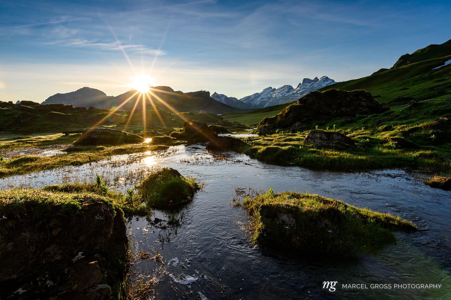 Peak of Titlis with alpine creek near Melchseefrutt at sunrise in the swiss alps. Taken by Marcel Gross Photography