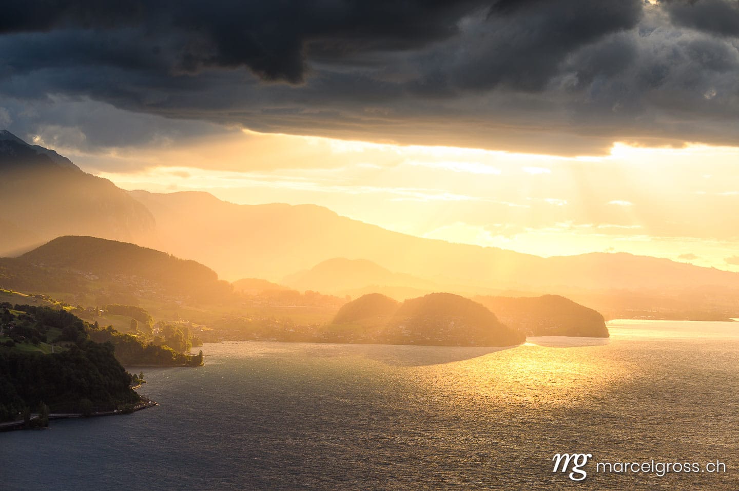 . dramatic sunset over Lake Thun with Stockhorn ridge, Spiez and Faulensee. Marcel Gross Photography