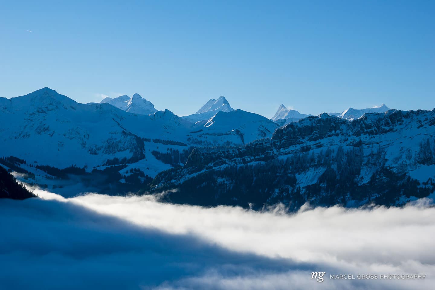 View over the sea of fog near Marbachegg. Taken by Marcel Gross Photography