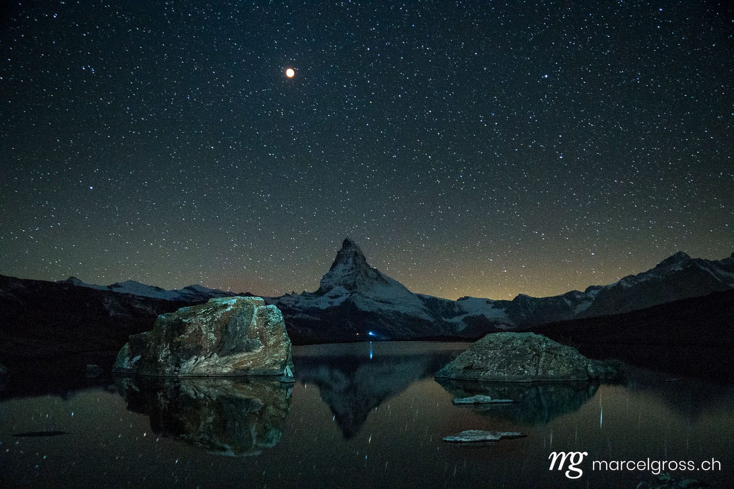 . Matterhorn at blood moon with reflection in alpine lake. Marcel Gross Photography