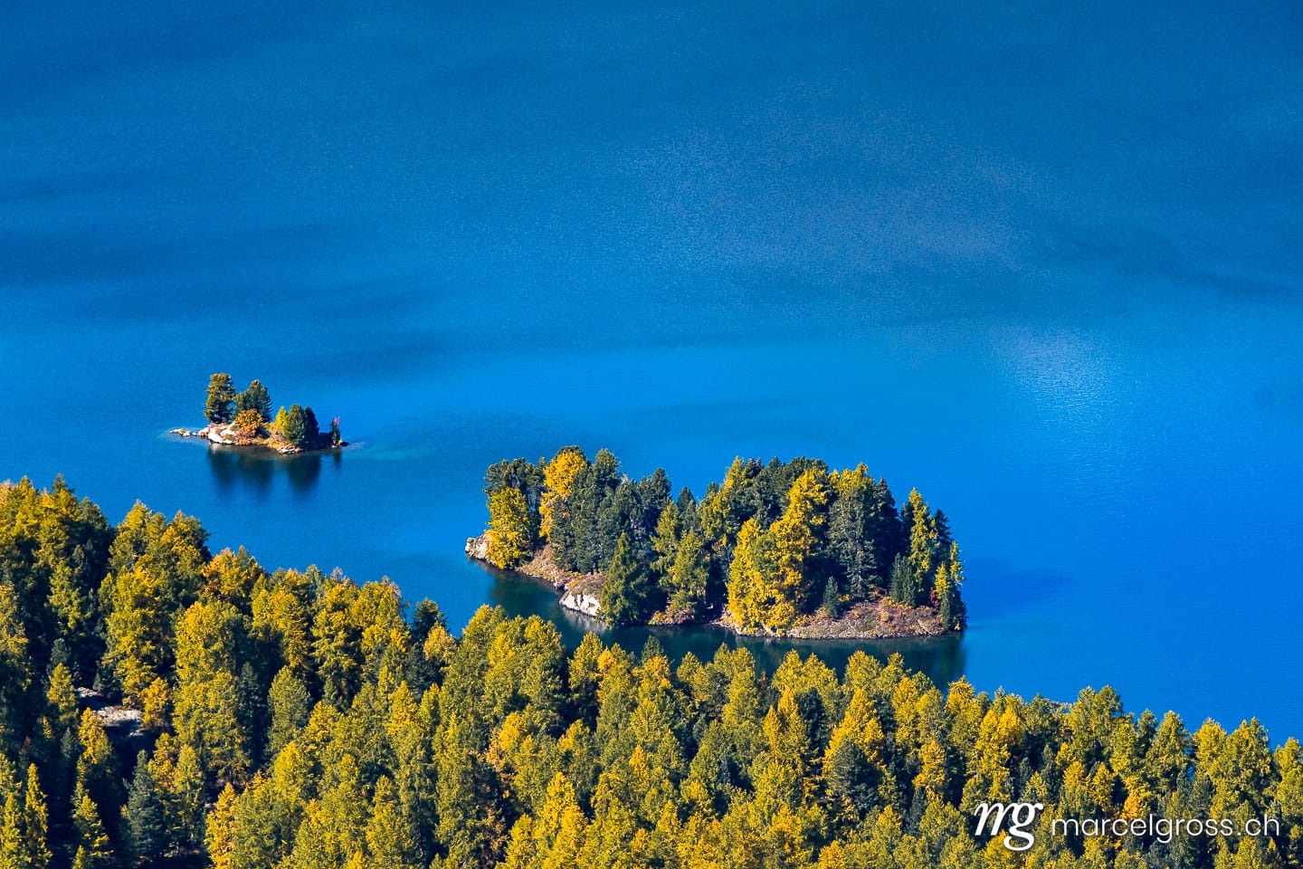. island in Lake Sils in Engadin in Autumn. Marcel Gross Photography