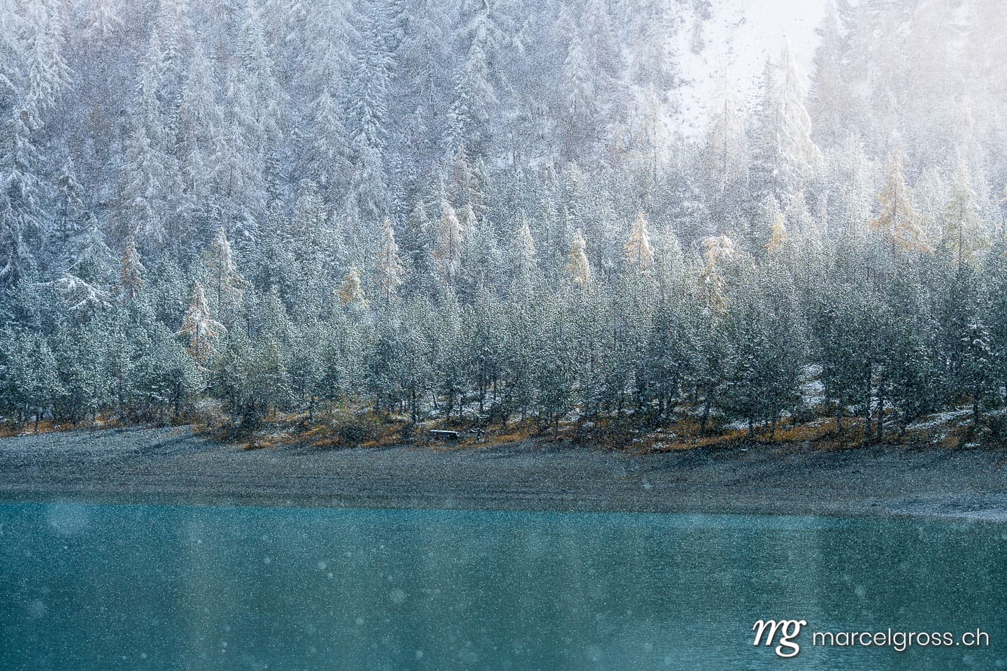 . mountain lake Oeschinensee in snowfall in the Bernese Alps. Marcel Gross Photography