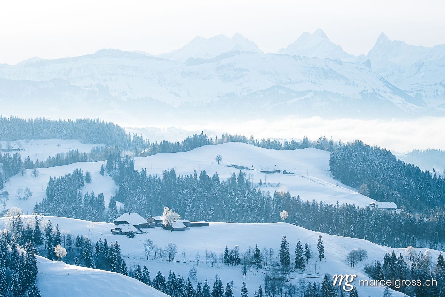 Winter picture Switzerland. remote traditional farm house in the hills of Emmental in winter. Marcel Gross Photography