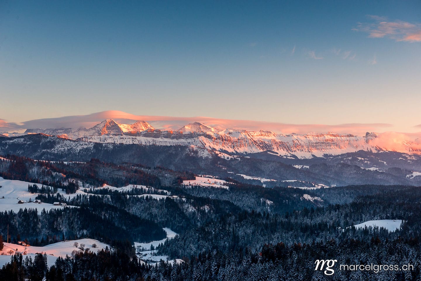 . Alpenglow in winter on Eiger Mönch and Jungfrau in the Bernese Alps. Marcel Gross Photography