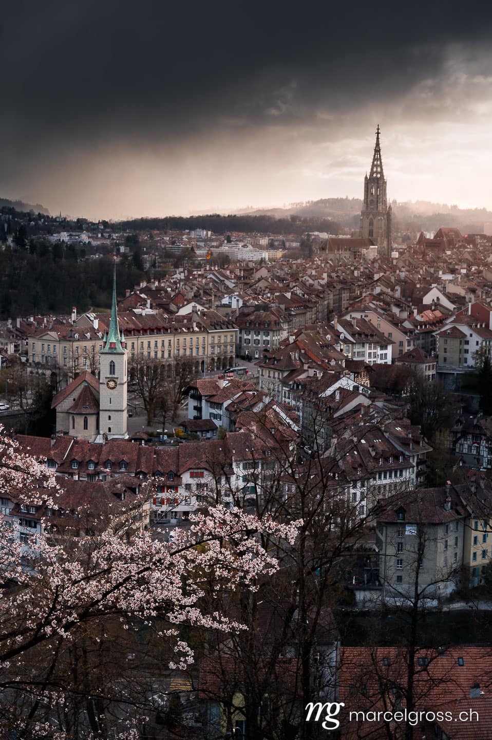 Bern Bilder. dramatic clouds over the oldtown of Bern in spring. Marcel Gross Photography