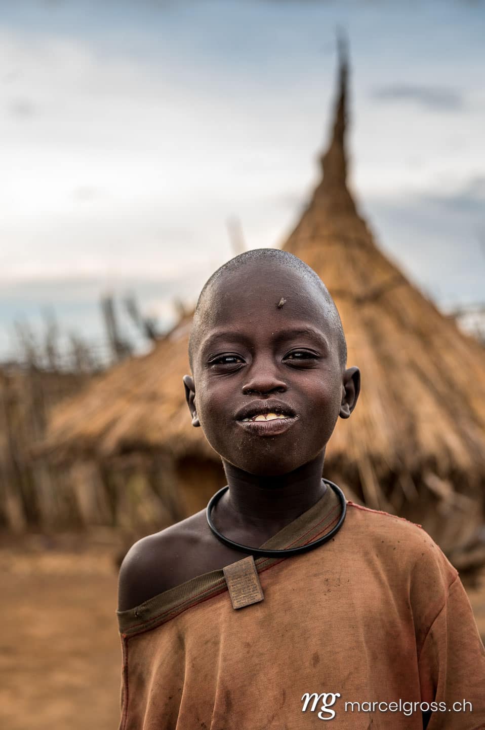 Uganda Bilder. a karamojong boy in the remote Karamoja Region of Uganda. Marcel Gross Photography