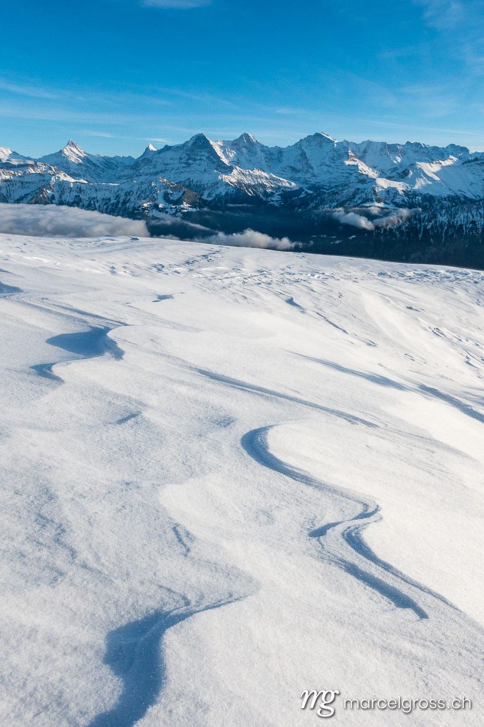 . snow drift in front of the Bernese Alps with Eiger, Mönch and Jungfrau. Marcel Gross Photography