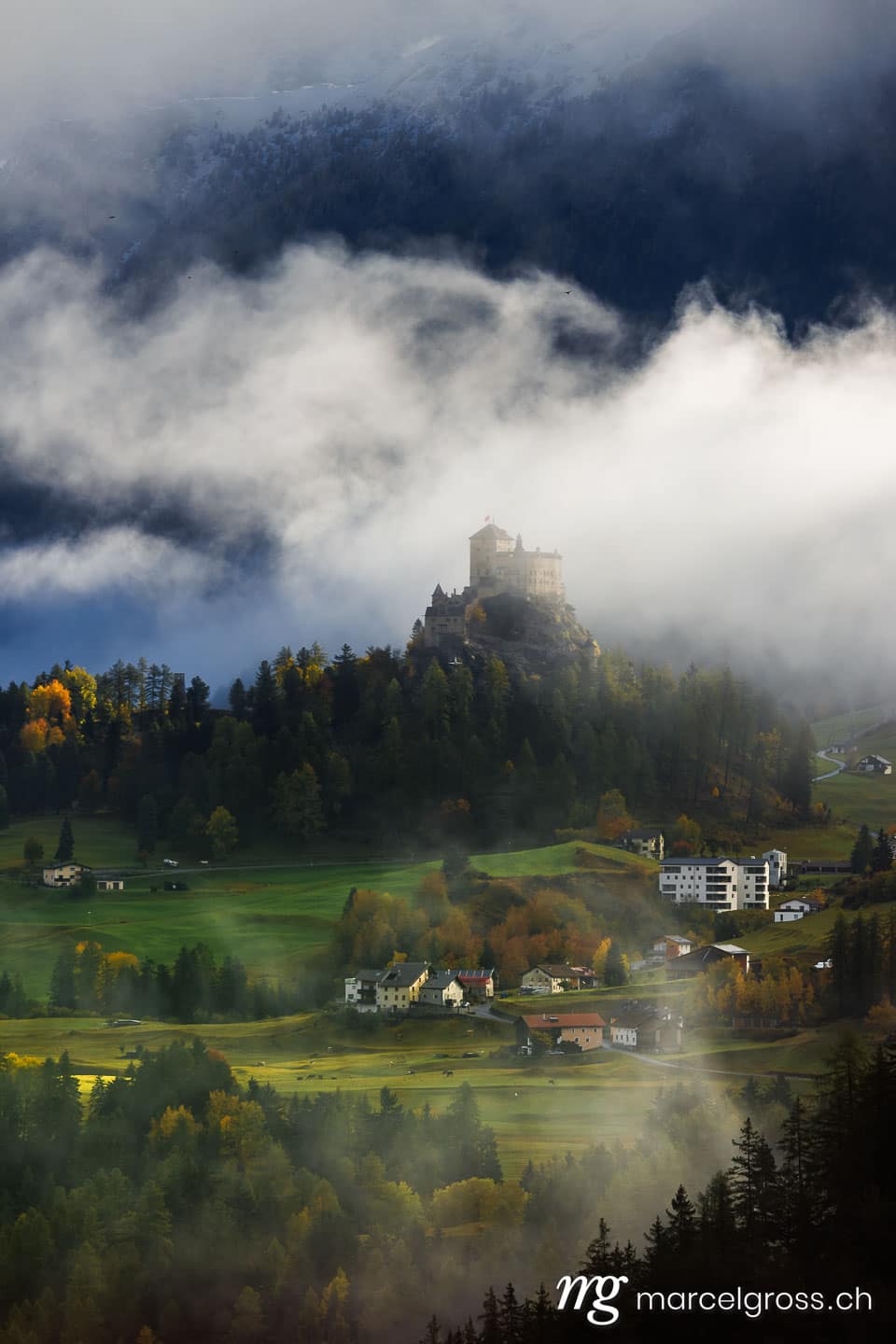 Engadin Bilder. castle Tarasp in autumn fog. Marcel Gross Photography