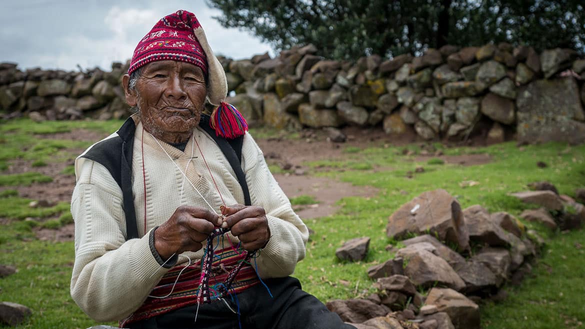 Taquile dweller knitting